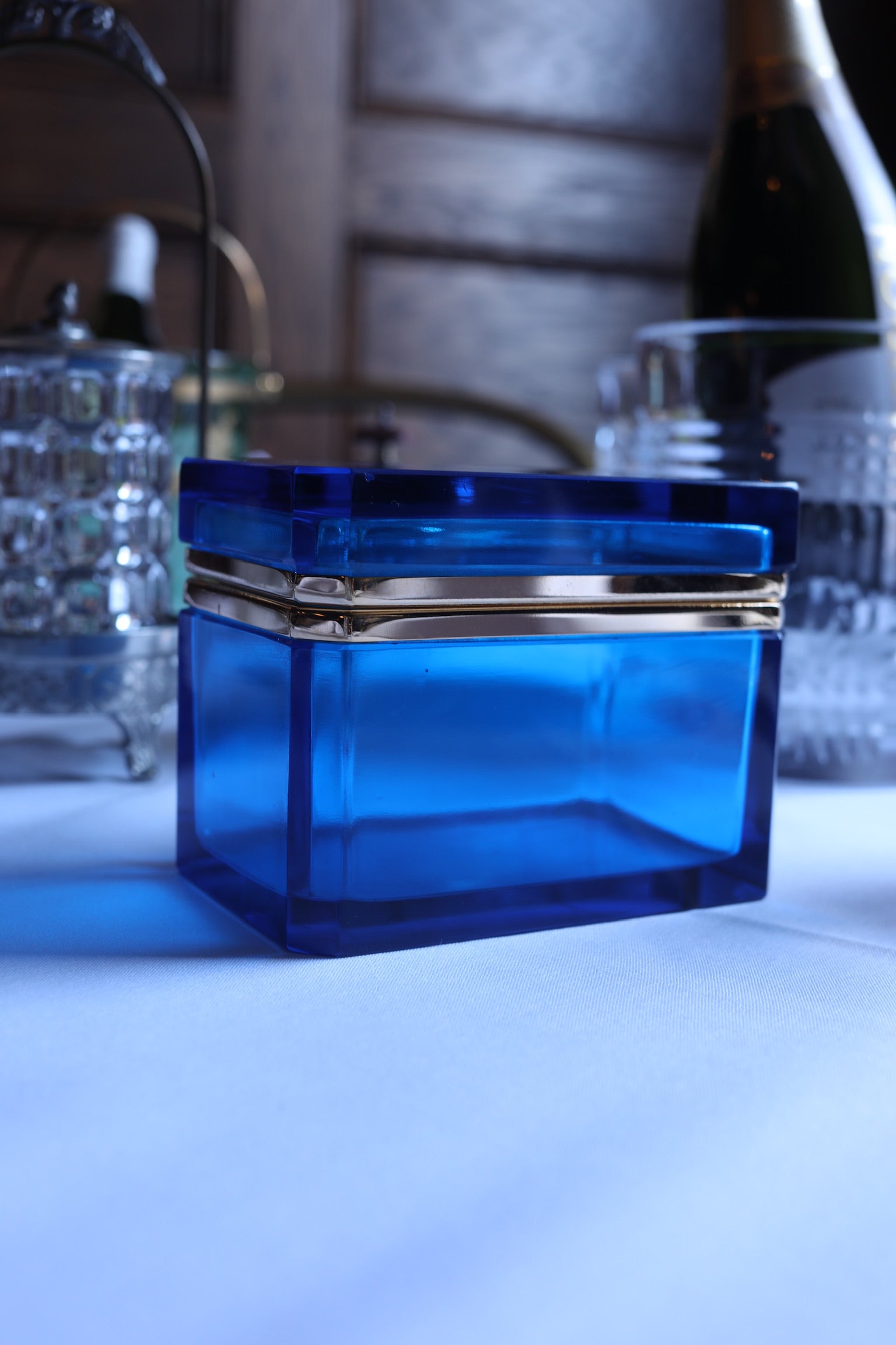 Front view of the closed vintage Murano cobalt glass box highlighting its square silhouette and gold-tone banded lid