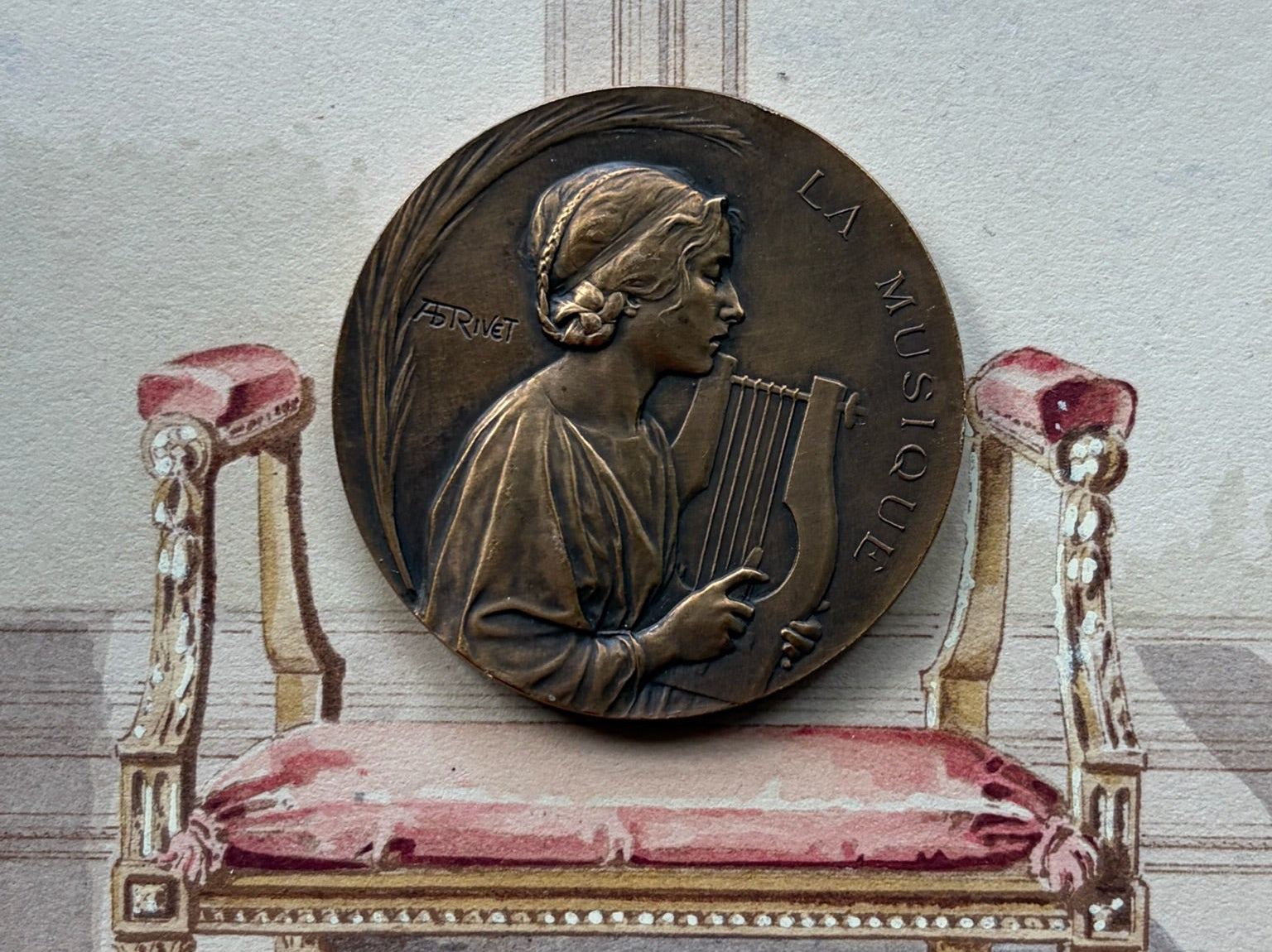 Signed Art Nouveau bronze medal "La Musique" by Adolphe Rivet depicting a robed maiden with a lyre